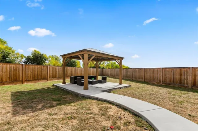 a front view of a building with an ocean