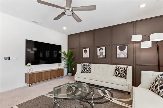 a kitchen with a dining table cabinets and stainless steel appliances