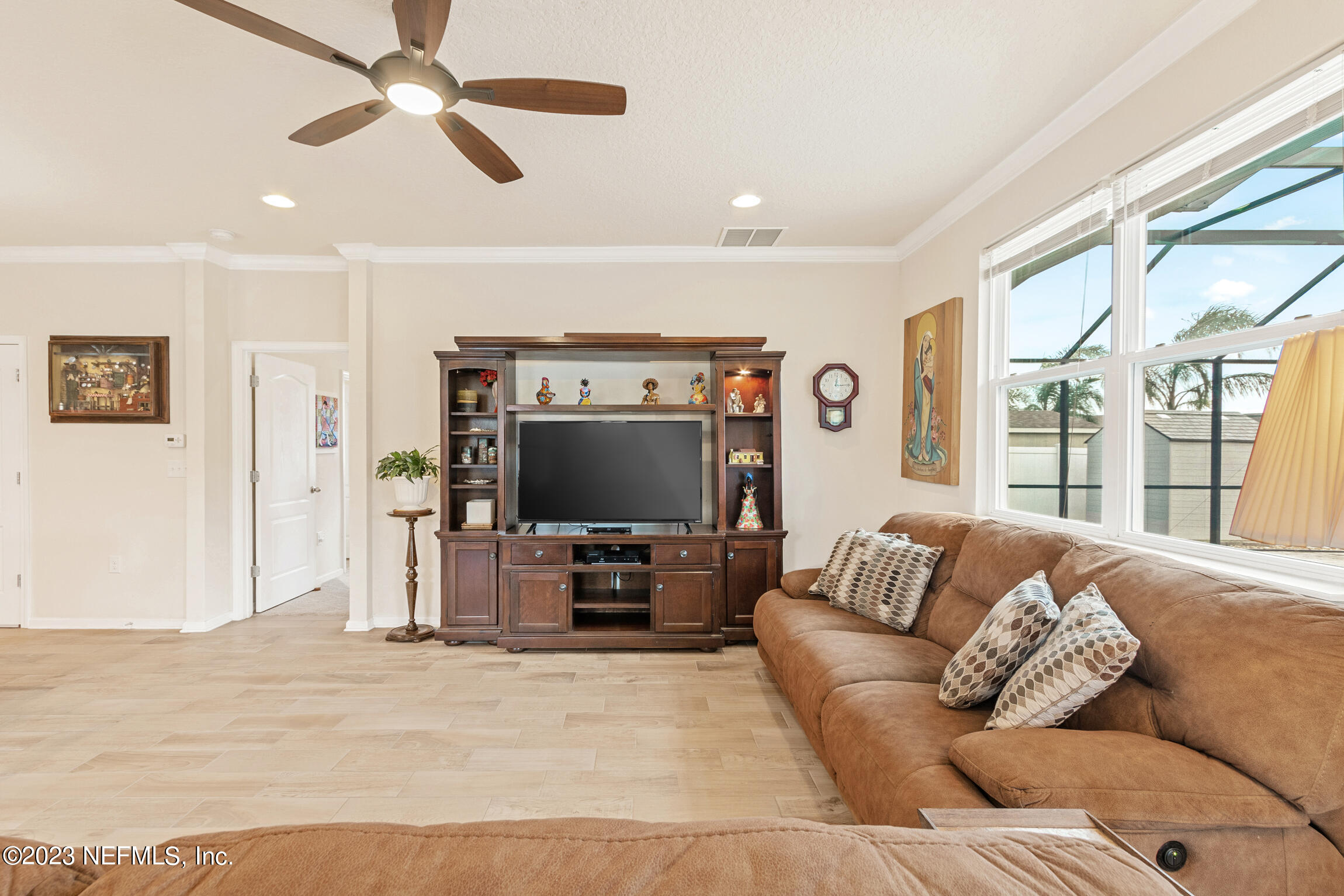 57 Deer Crossing Road St. Augustine, FL 32086 - Photo 19 of 48 a living room with furniture and a flat screen tv