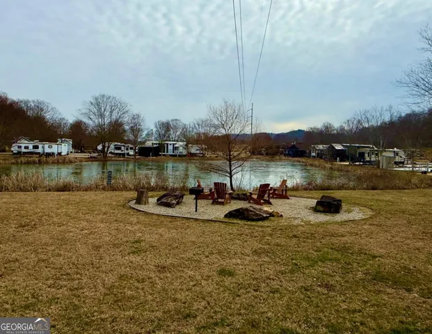 a view of a car park in front of a house