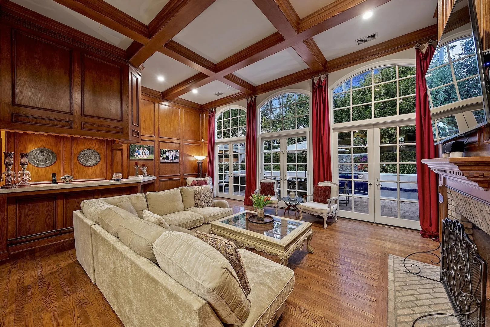 7583 St Andrews Road Rancho Santa Fe, CA 92067 - Photo 14 of 30 a living room with furniture a fireplace and a floor to ceiling window