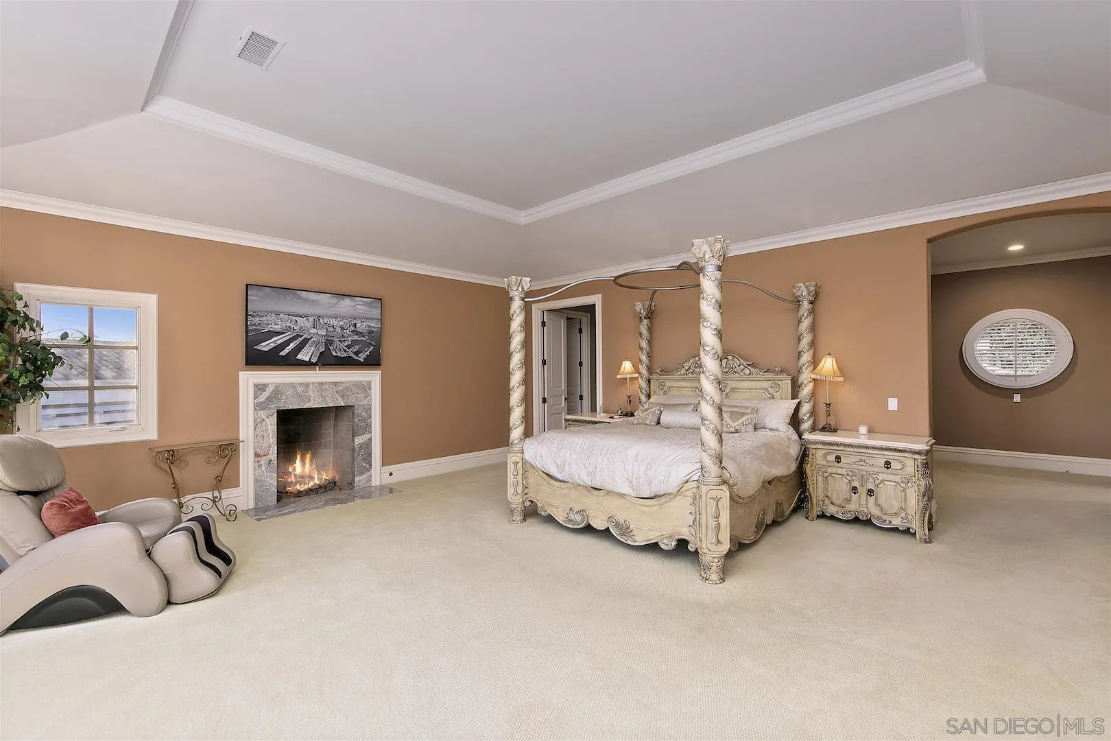 7583 St Andrews Road Rancho Santa Fe, CA 92067 - Photo 16 of 30 a spacious bedroom with a bed and a fireplace