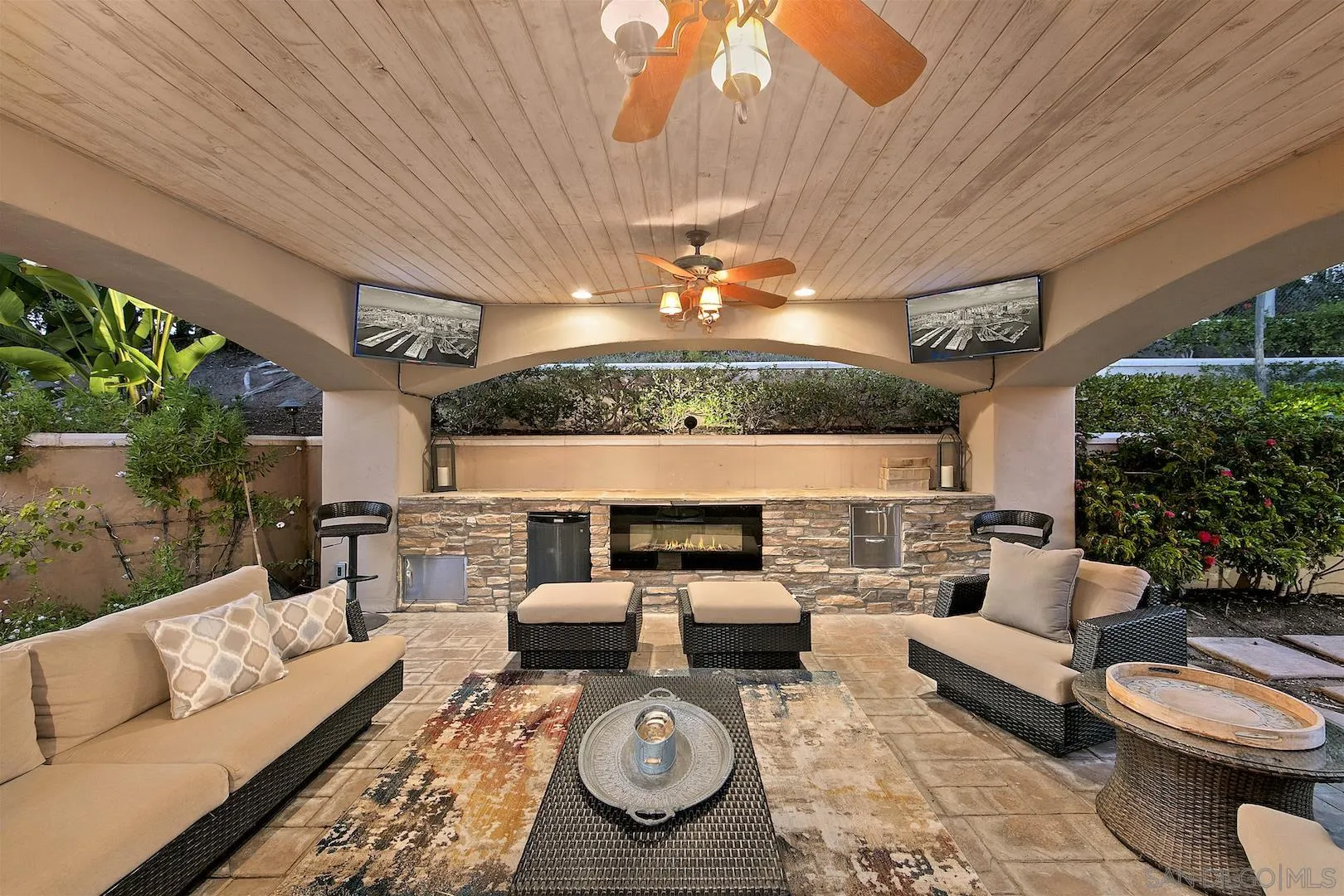 7583 St Andrews Road Rancho Santa Fe, CA 92067 - Photo 23 of 30 a living room with furniture a rug and a fireplace