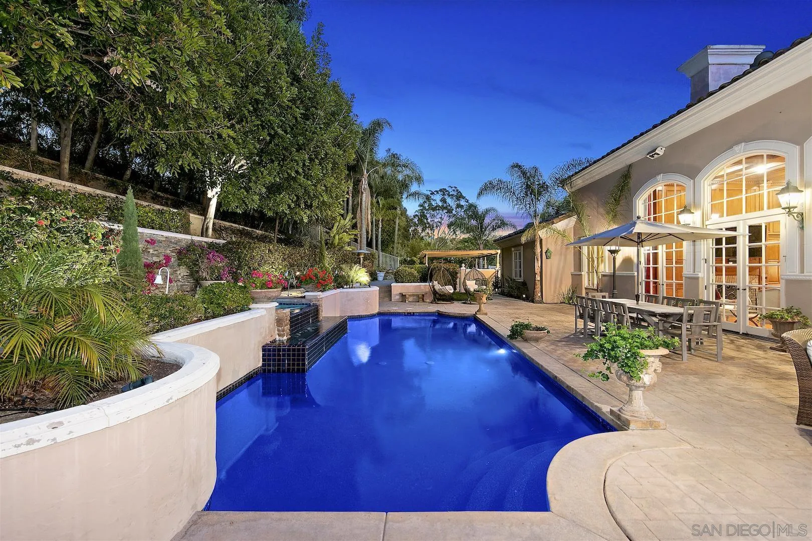 7583 St Andrews Road Rancho Santa Fe, CA 92067 - Photo 27 of 30 a view of a swimming pool with a patio