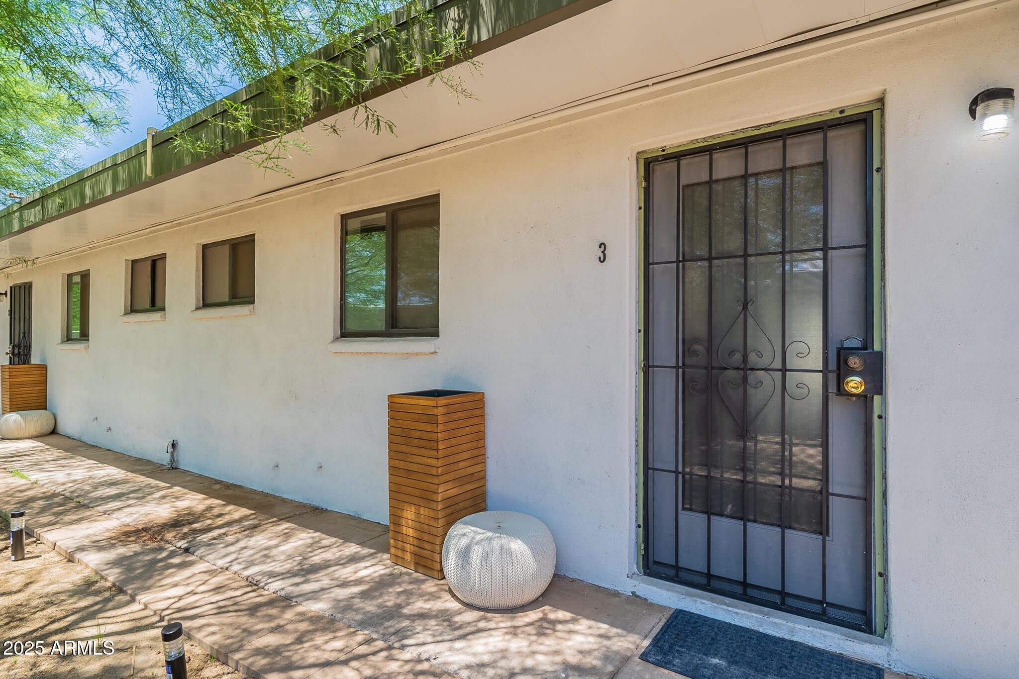4351 North 36th Street, Unit 3 Phoenix, AZ 85018 - Photo 1 of 19 a front view of a house with a yard