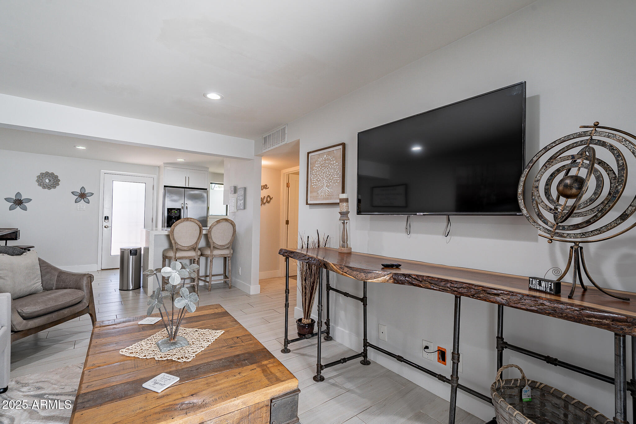 4351 North 36th Street, Unit 3 Phoenix, AZ 85018 - Photo 11 of 19 a living room with furniture and a flat screen tv