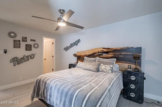 a bedroom with a bed and a tv