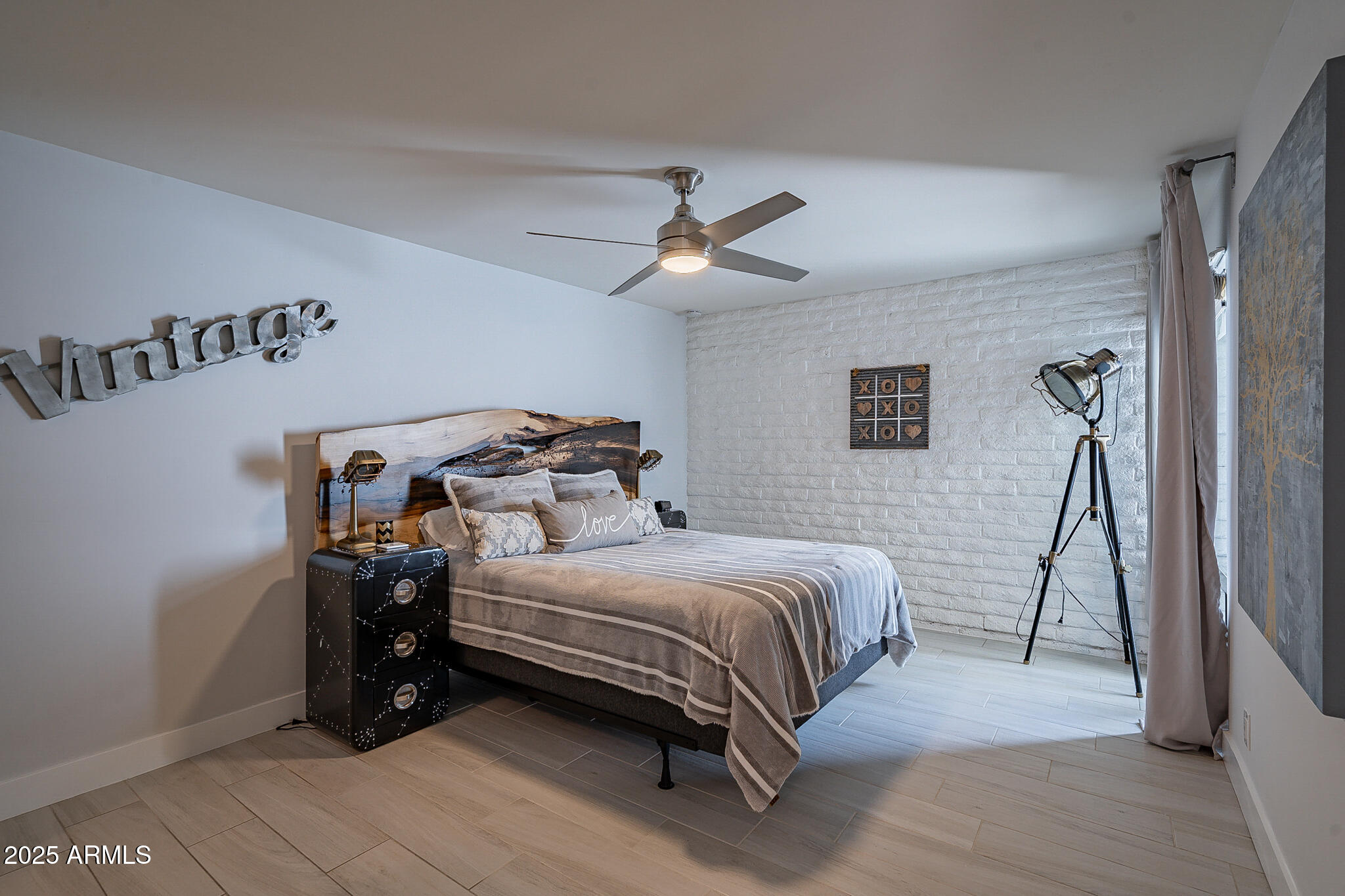 4351 North 36th Street, Unit 3 Phoenix, AZ 85018 - Photo 13 of 19 a bedroom with a bed and a ceiling fan
