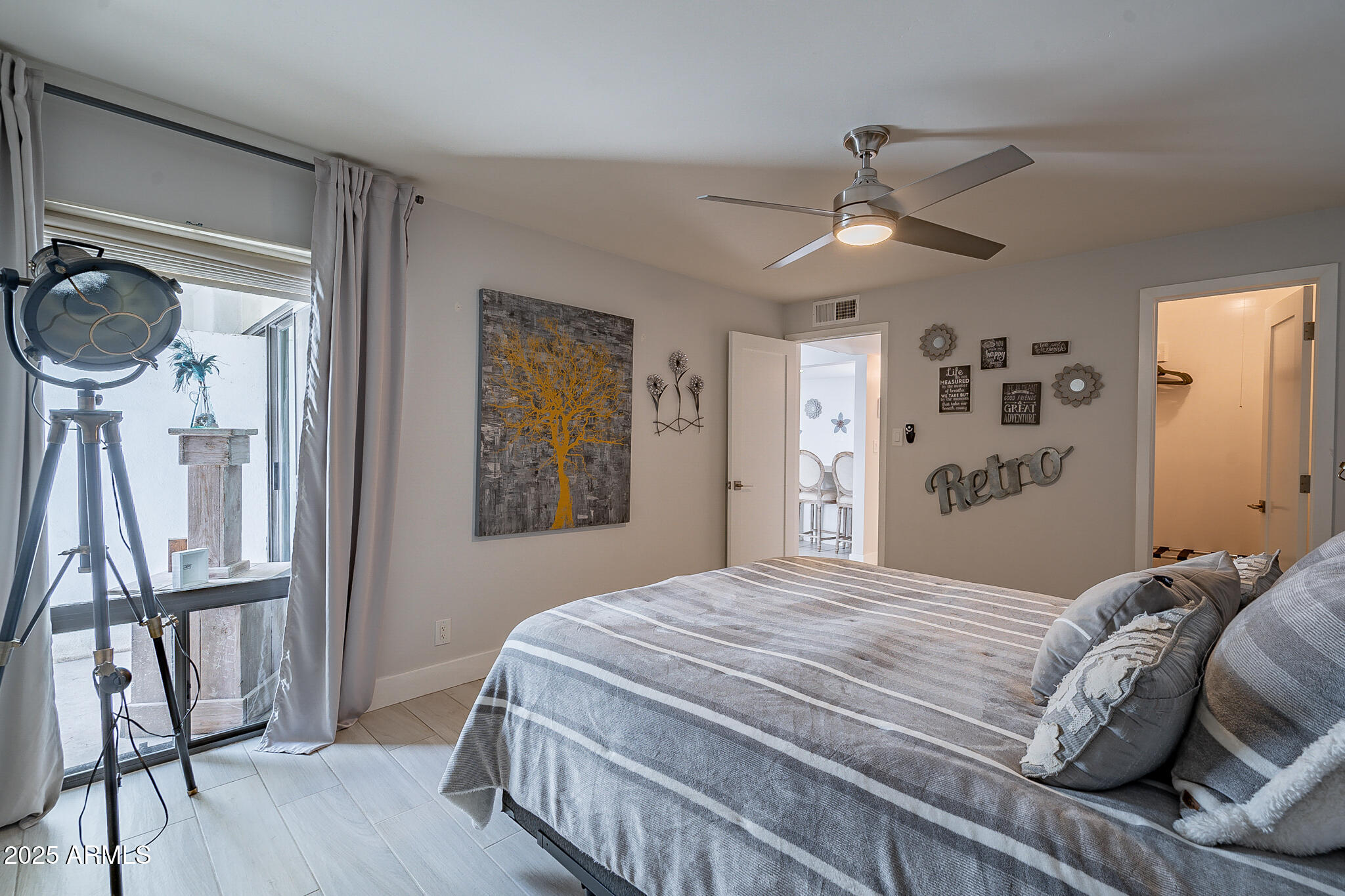 4351 North 36th Street, Unit 3 Phoenix, AZ 85018 - Photo 14 of 19 a bedroom with a bed chandelier and a window