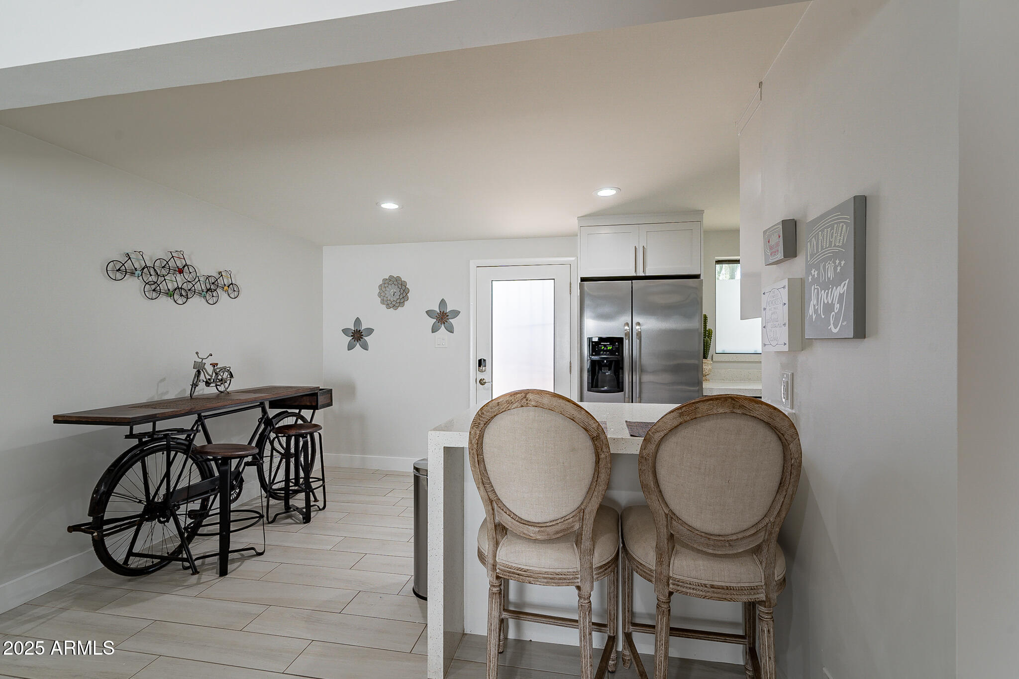 4351 North 36th Street, Unit 3 Phoenix, AZ 85018 - Photo 2 of 19 a very nice looking dining room with kitchen island furniture a sink and a mirror