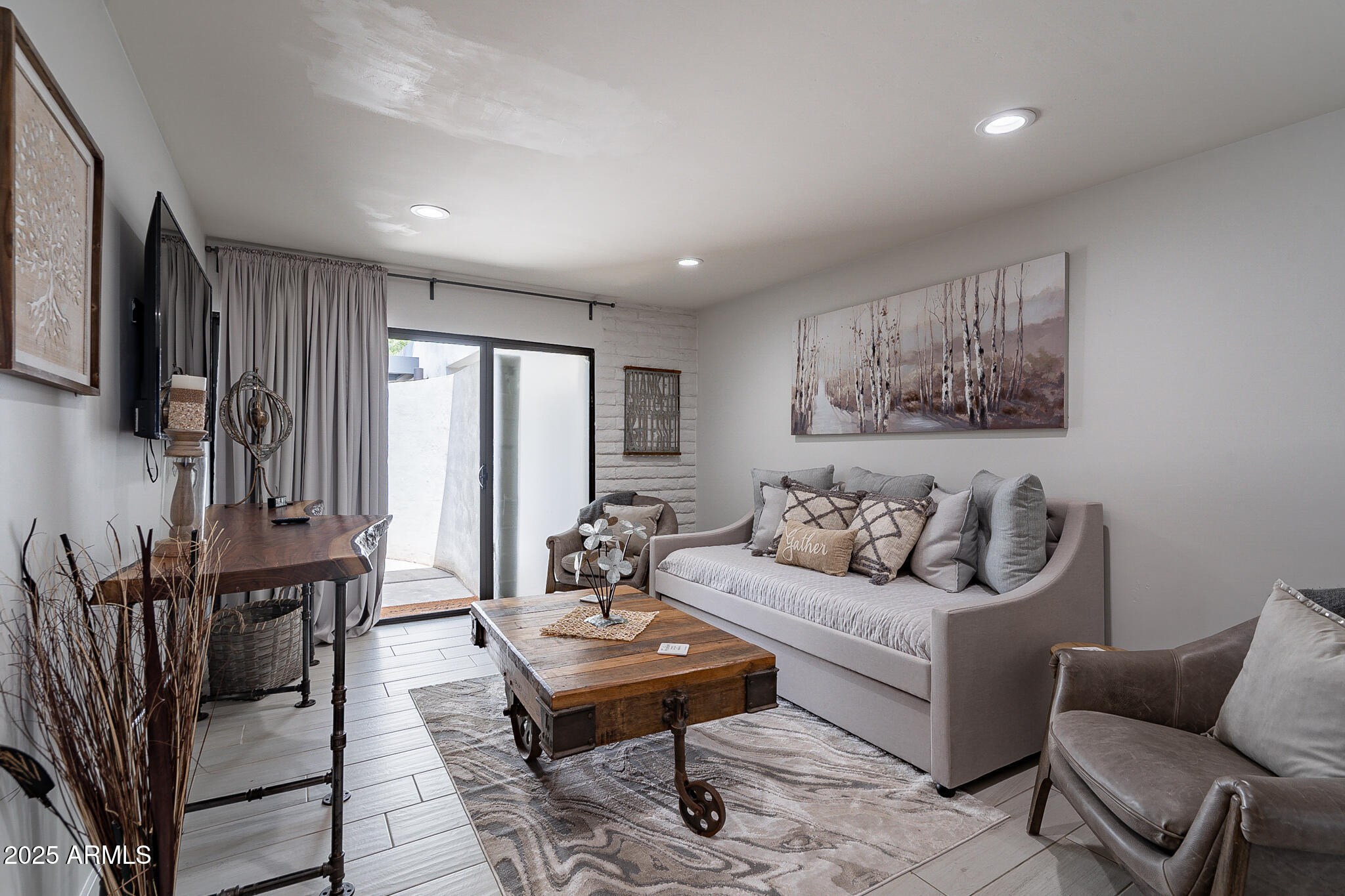 4351 North 36th Street, Unit 3 Phoenix, AZ 85018 - Photo 9 of 19 a living room with furniture a rug and a painting