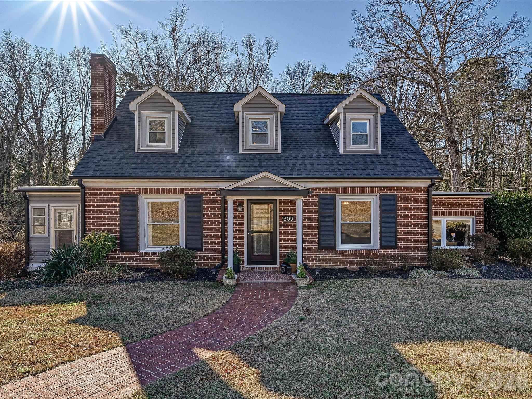 309 William Street Kannapolis, NC 28081 - Photo 1 of 38 a front view of a house with garden