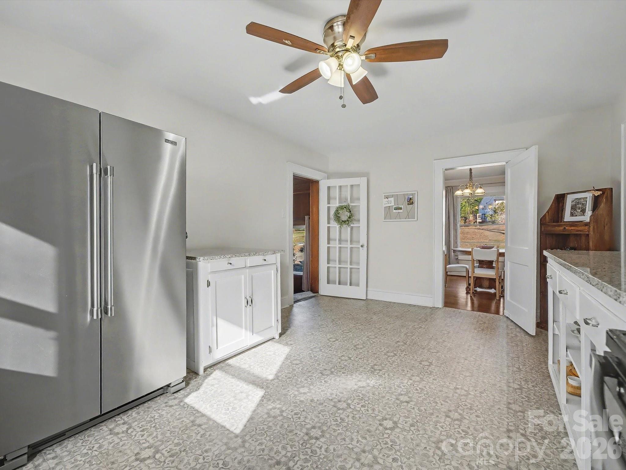 309 William Street Kannapolis, NC 28081 - Photo 12 of 38 a view of a kitchen with refrigerator and cabinet
