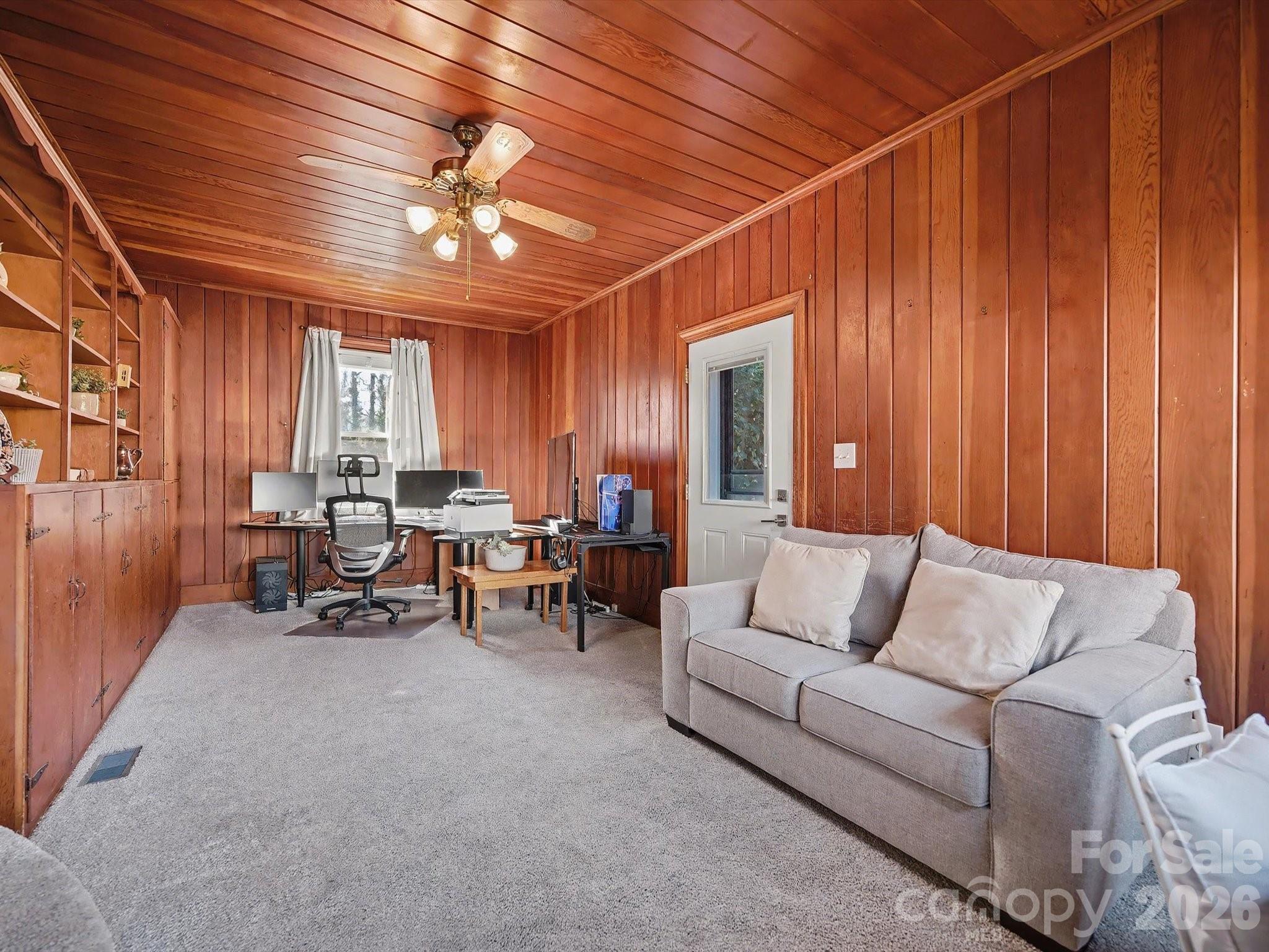 309 William Street Kannapolis, NC 28081 - Photo 14 of 38 a living room with furniture and a chandelier