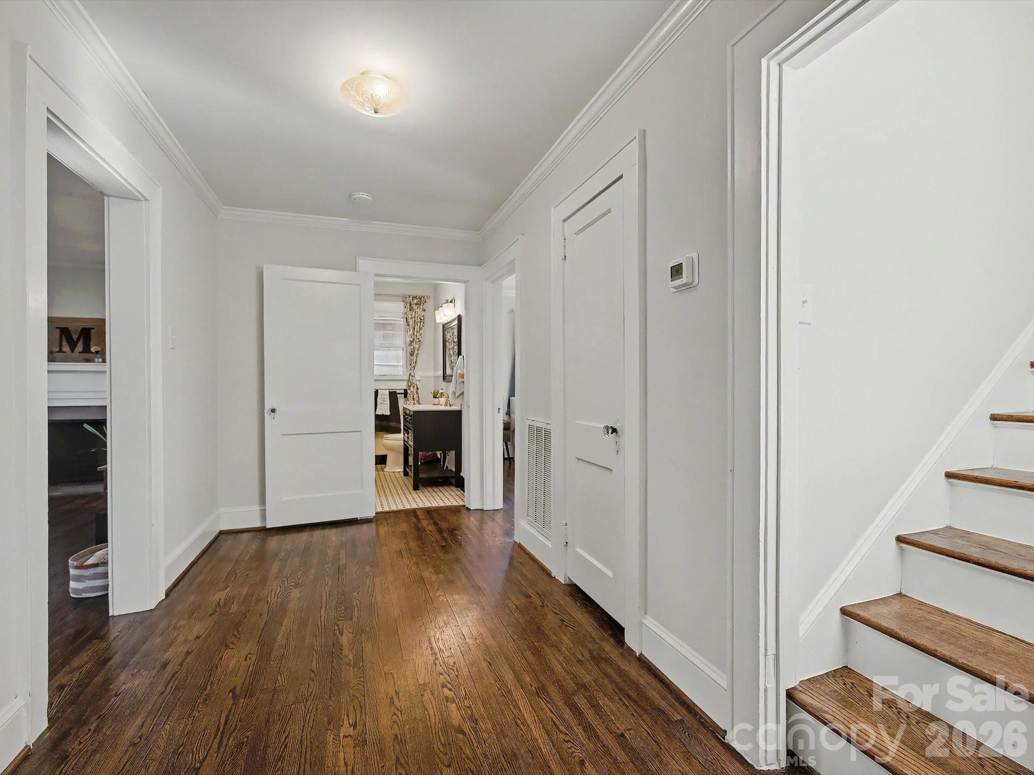 309 William Street Kannapolis, NC 28081 - Photo 17 of 38 a view of a hallway with wooden floor and staircase