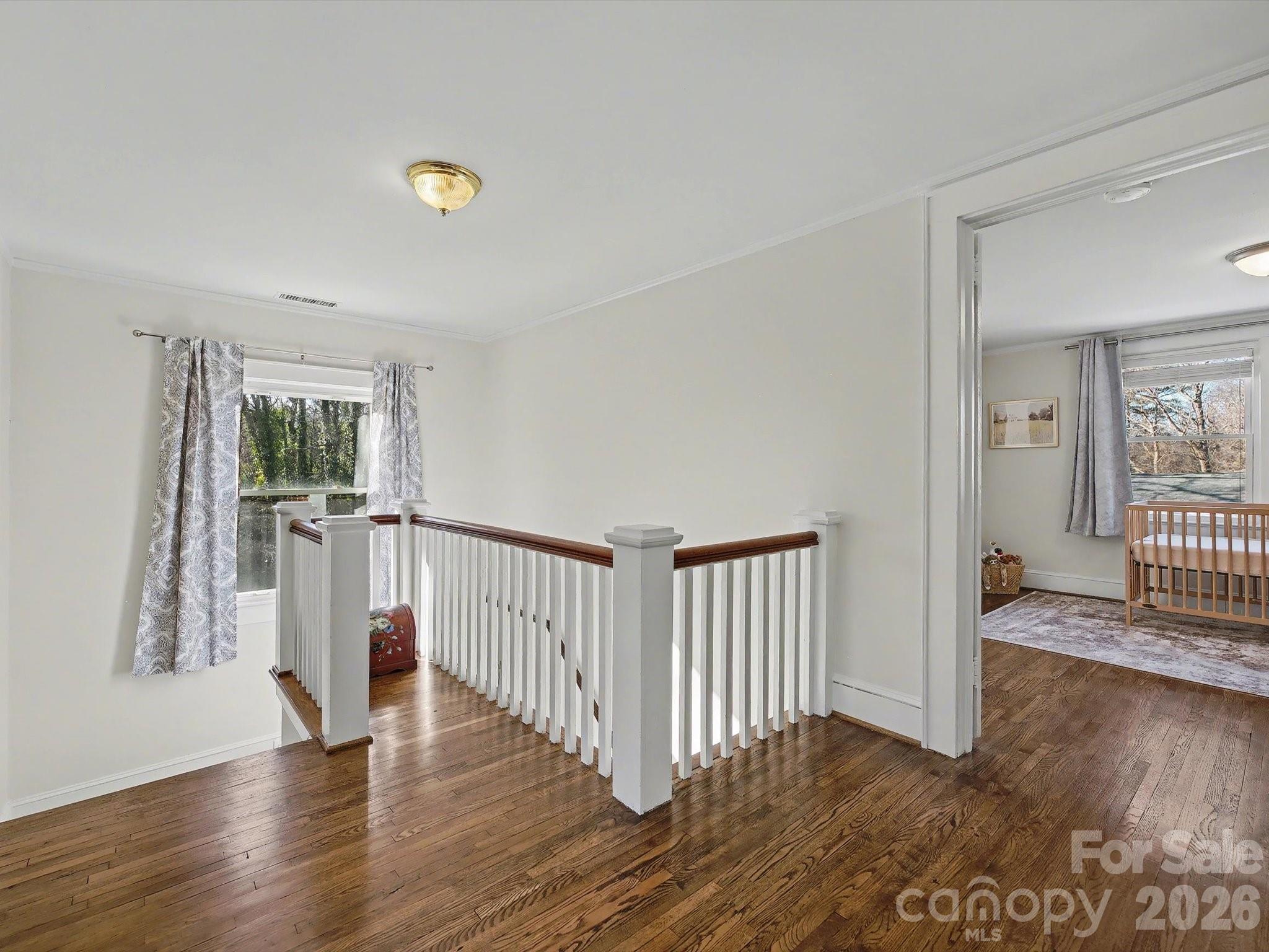 309 William Street Kannapolis, NC 28081 - Photo 20 of 38 a view of a hallway with wooden floor and livingroom