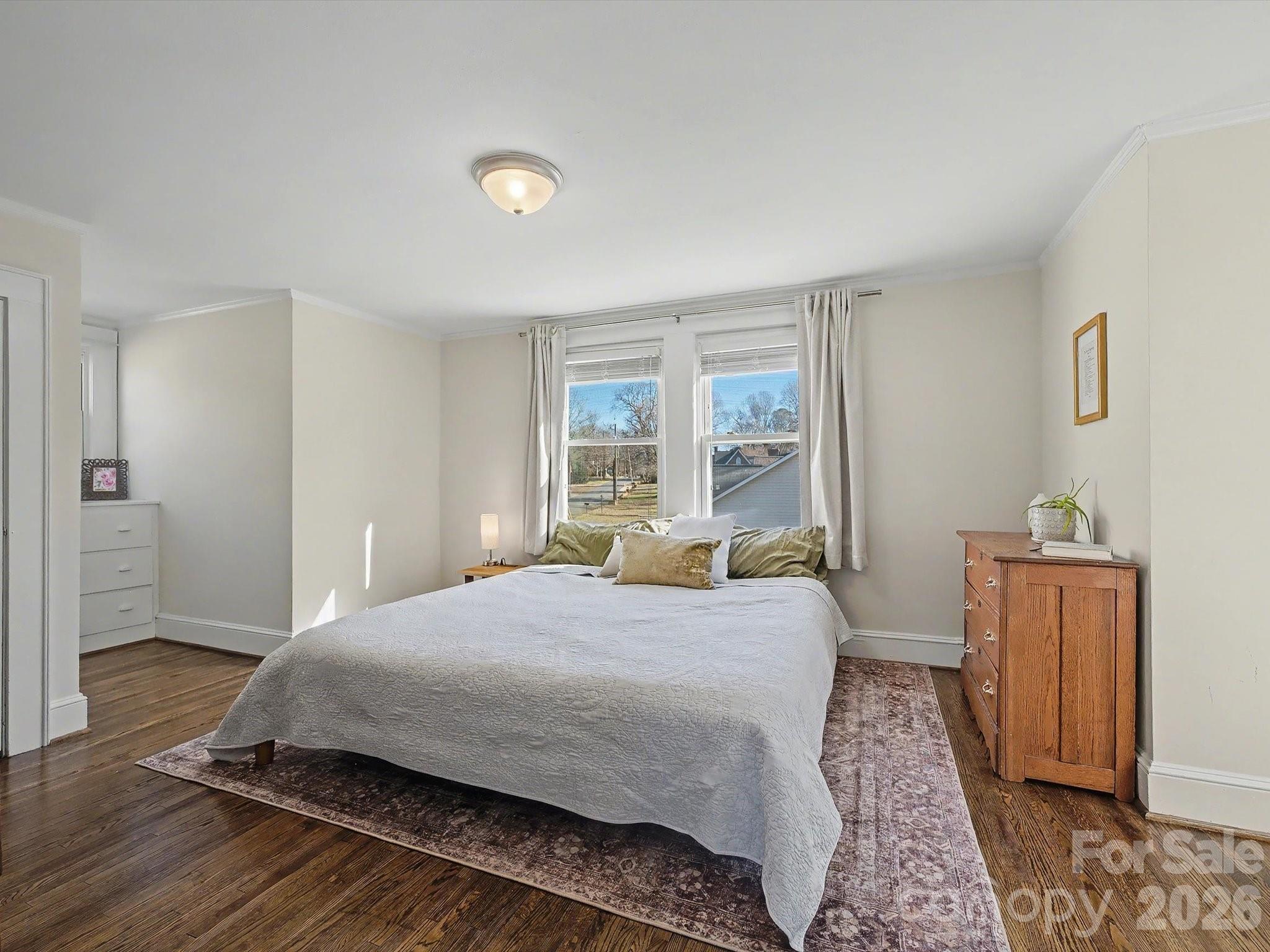309 William Street Kannapolis, NC 28081 - Photo 21 of 38 a bedroom with a bed and wooden floor