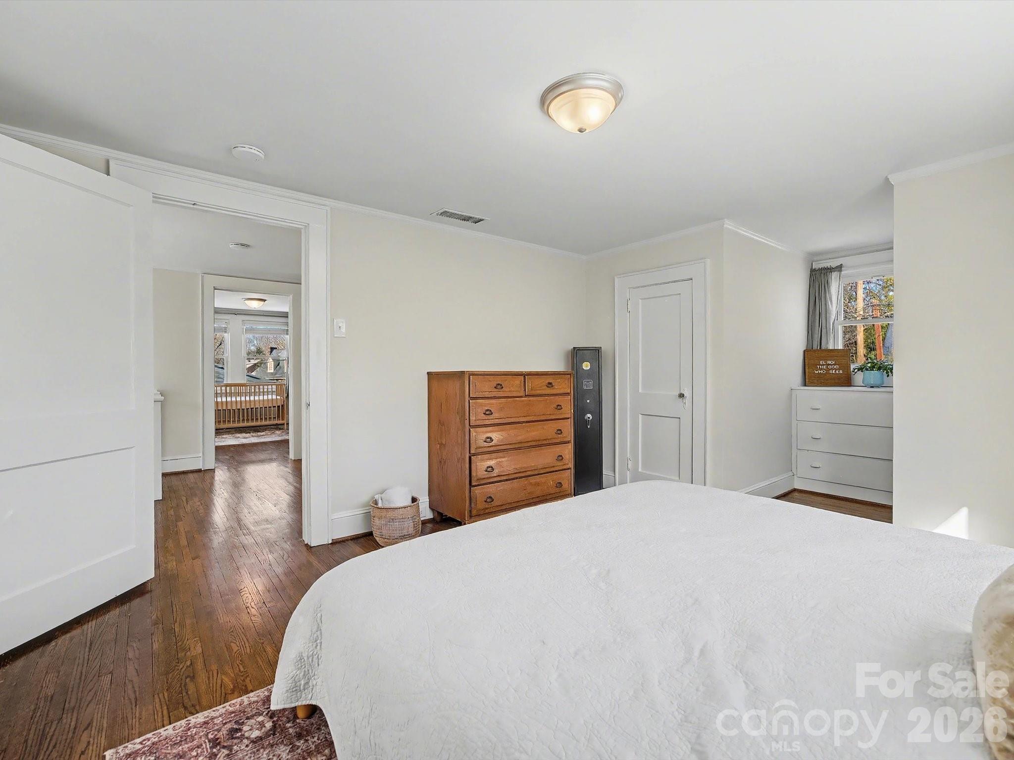 309 William Street Kannapolis, NC 28081 - Photo 24 of 38 a bedroom with a bed and a cabinets