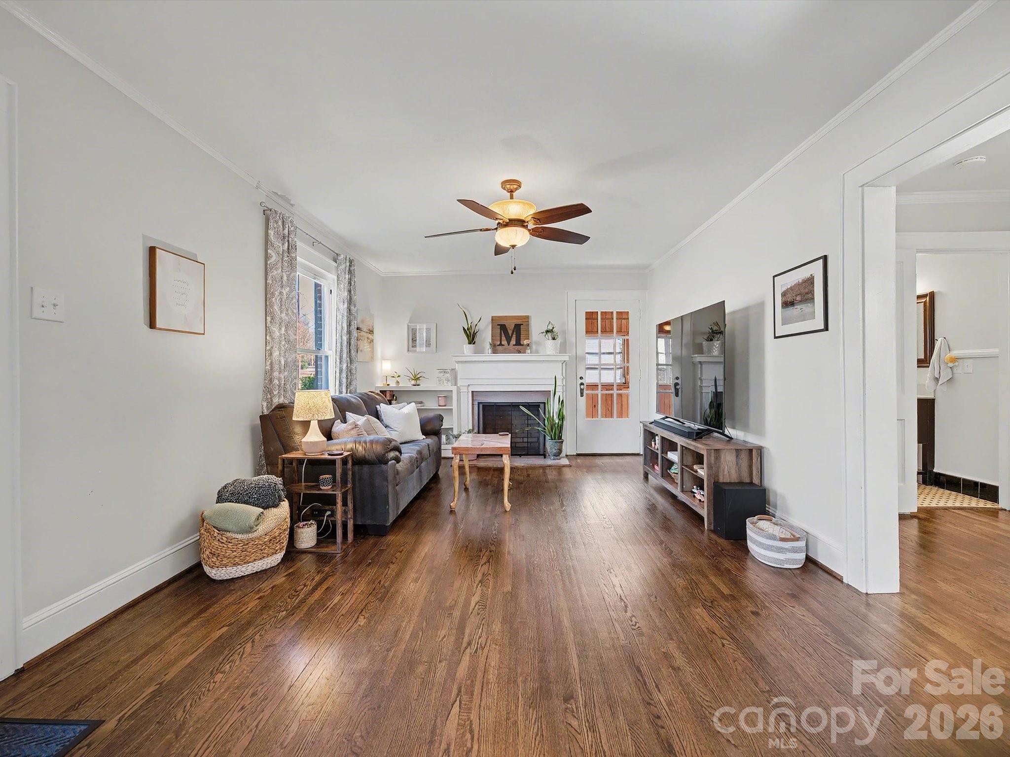 309 William Street Kannapolis, NC 28081 - Photo 3 of 38 a living room with furniture and a fireplace