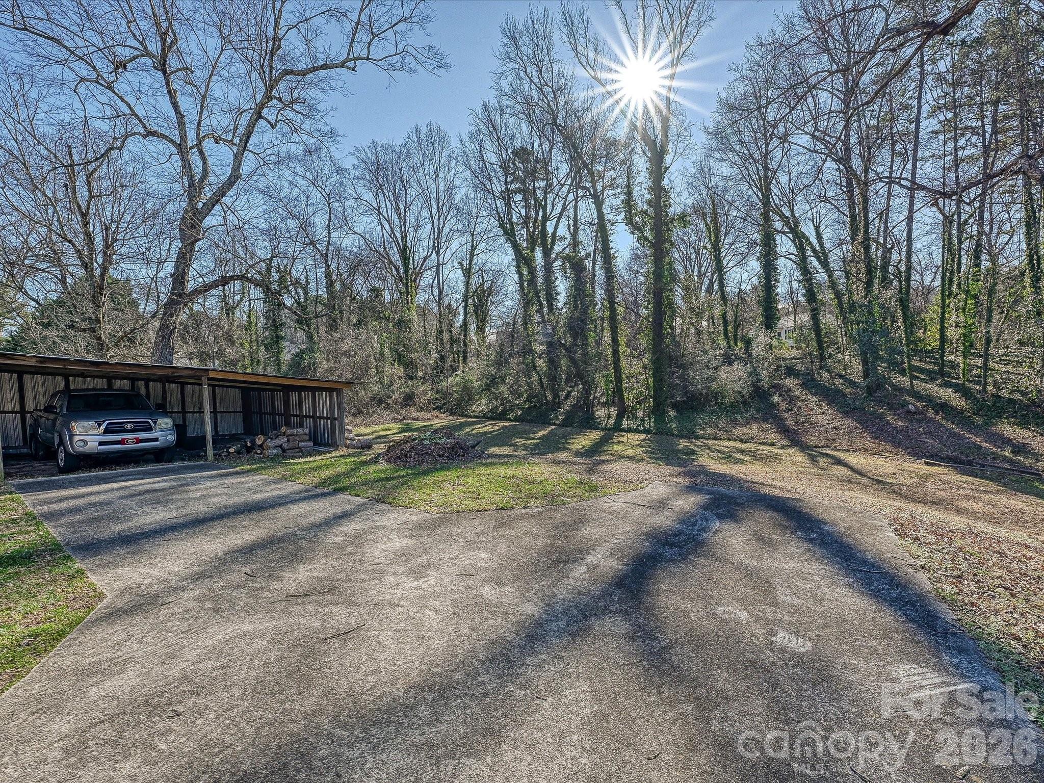 309 William Street Kannapolis, NC 28081 - Photo 32 of 38 a view of a house with large trees