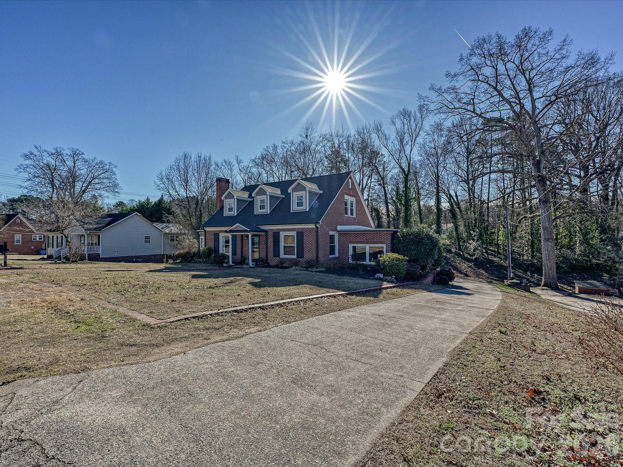 309 William Street Kannapolis, NC 28081 - Photo 36 of 38 a front view of a house with a yard