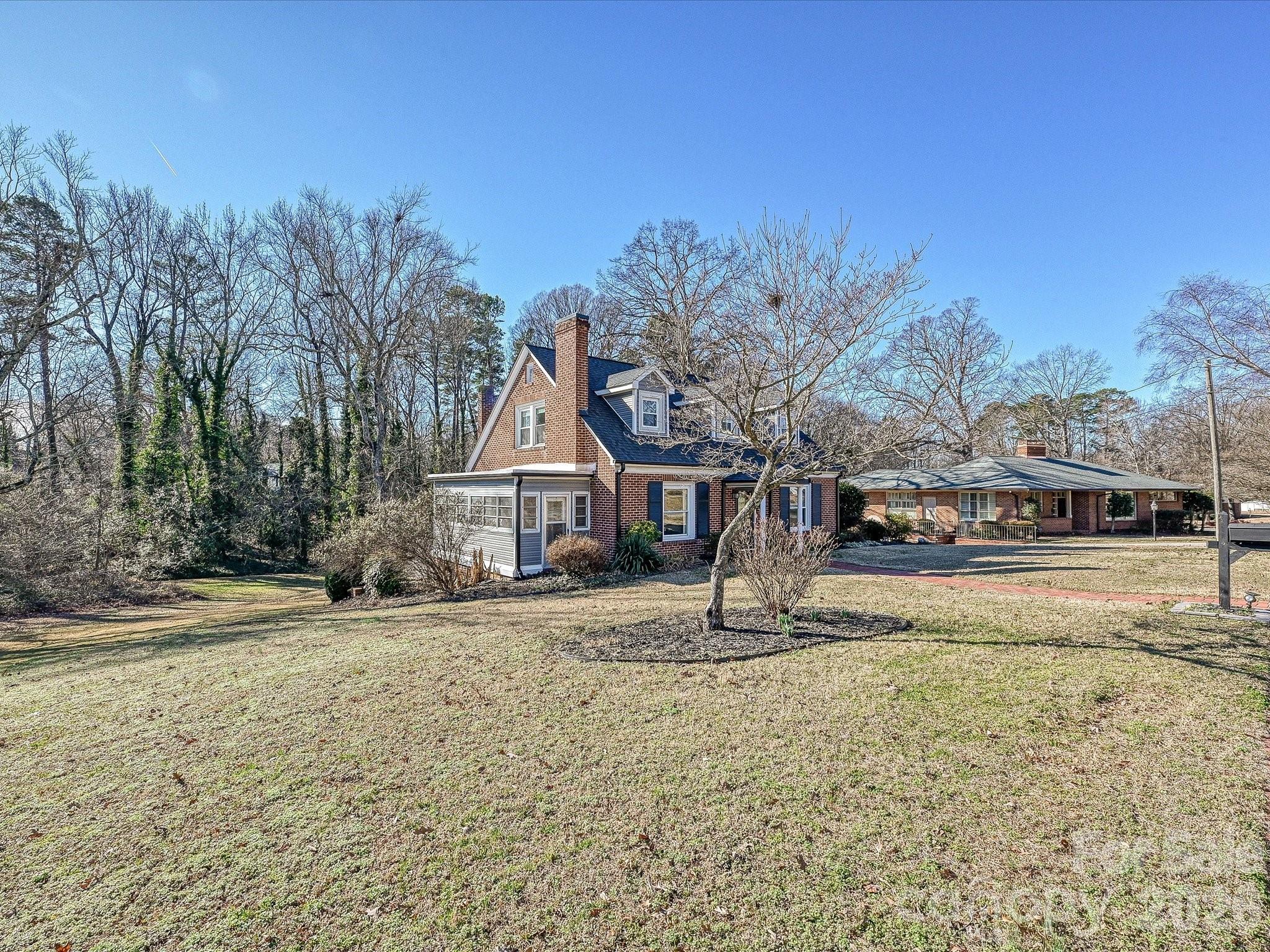 309 William Street Kannapolis, NC 28081 - Photo 37 of 38 a front view of a house with a yard
