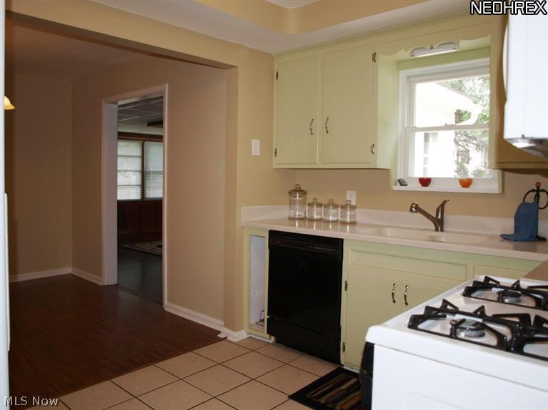 1577 Wood Road Cleveland, OH 44121 - Photo 13 of 25 View of kitchen, dining area and family room from side entrance
