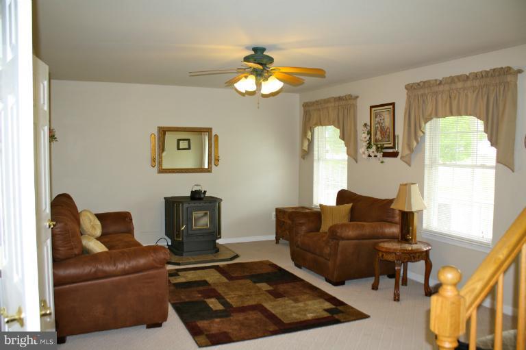 1950 Lowery Road Huntingtown, MD 20639 - Photo 1 of 28 a living room with furniture and a window
