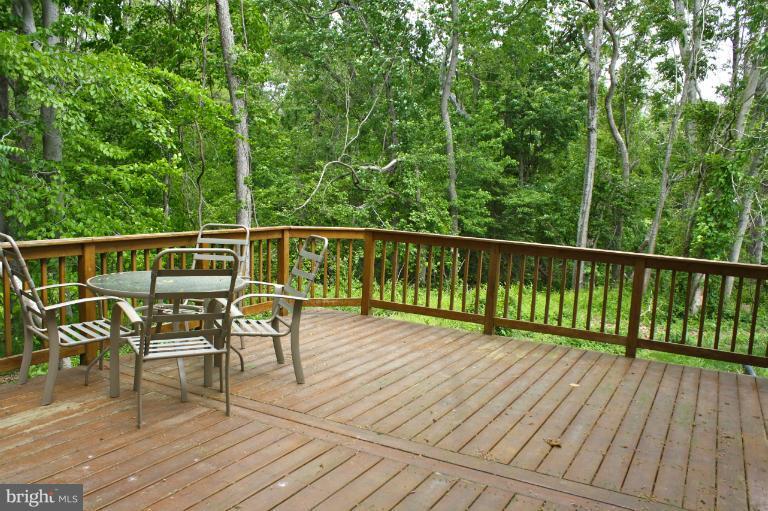 1950 Lowery Road Huntingtown, MD 20639 - Photo 11 of 28 a view of a chairs and table on the wooden floor