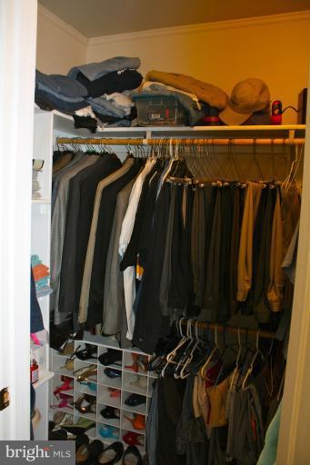 1950 Lowery Road Huntingtown, MD 20639 - Photo 20 of 28 a view of walk in closet with clothes and shoes