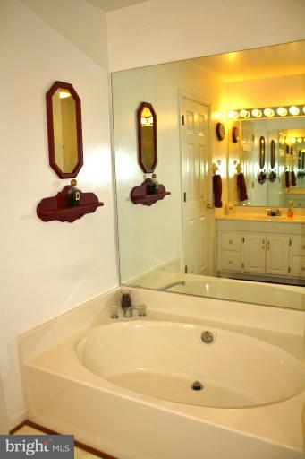 1950 Lowery Road Huntingtown, MD 20639 - Photo 26 of 28 a bathroom with a tub