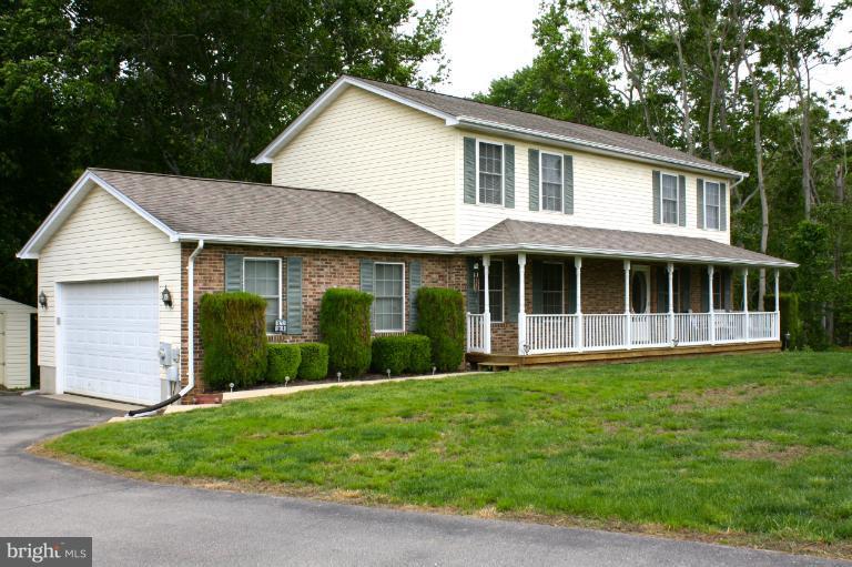 1950 Lowery Road Huntingtown, MD 20639 - Photo 28 of 28 a view of a yard in front of a house with large windows