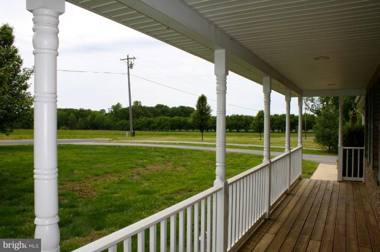 1950 Lowery Road Huntingtown, MD 20639 - Photo 4 of 28 a view of a deck with a big yard