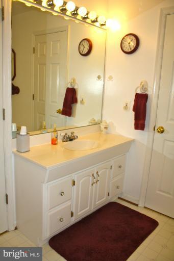1950 Lowery Road Huntingtown, MD 20639 - Photo 9 of 28 a bathroom with a sink and a mirror