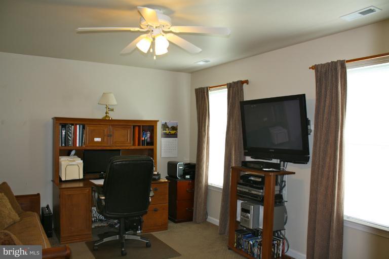 1950 Lowery Road Huntingtown, MD 20639 - Photo 10 of 28 a view of a workspace with furniture and a window