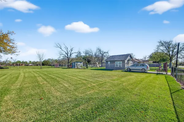 a view of a house with a big yard