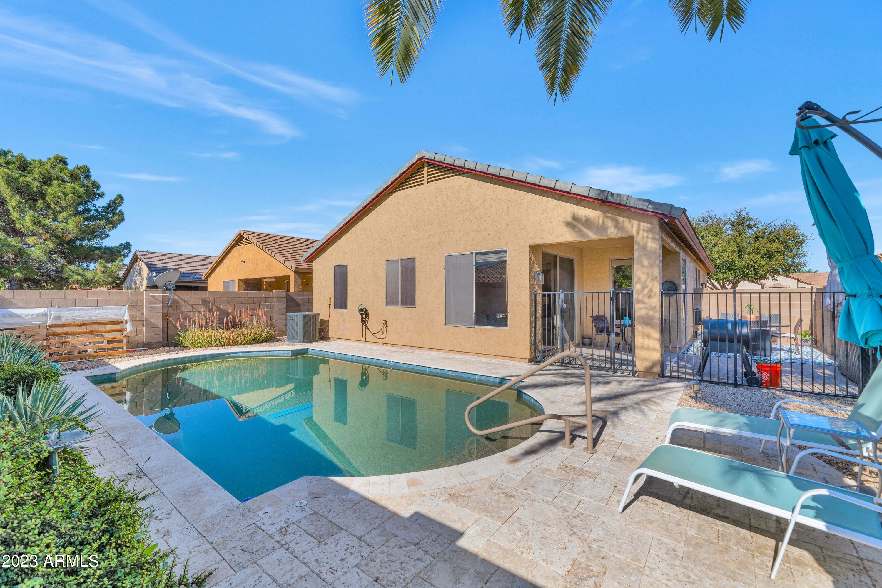 303 North Kimberlee Way Chandler, AZ 85225 - Photo 22 of 31 an outdoor space with swimming pool and furniture