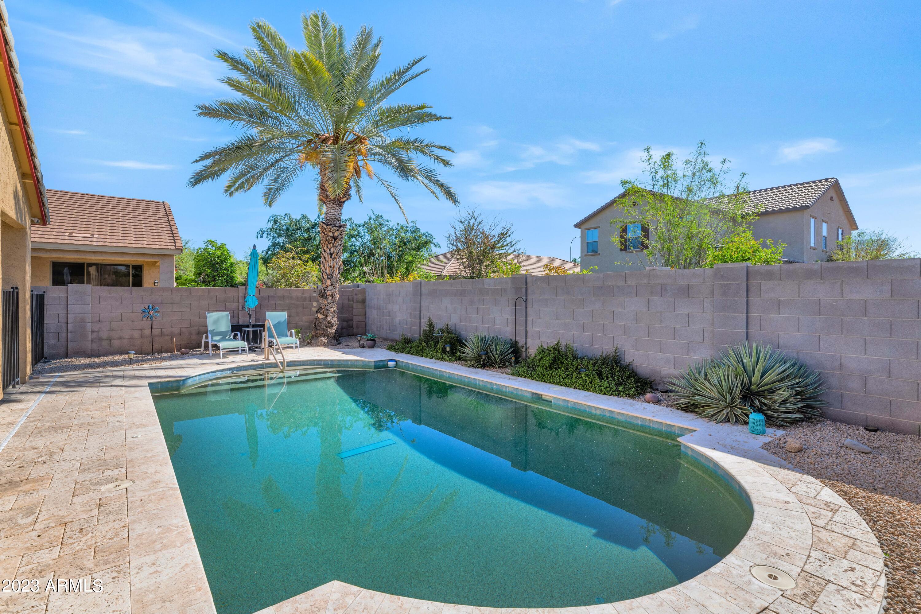 303 North Kimberlee Way Chandler, AZ 85225 - Photo 24 of 31 a view of a swimming pool and lounge chair