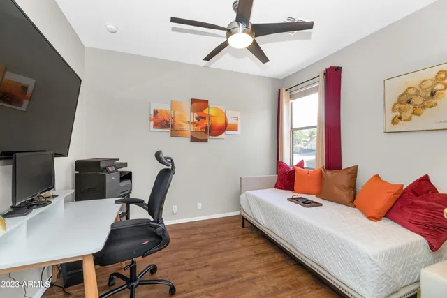 a bedroom with furniture and a window