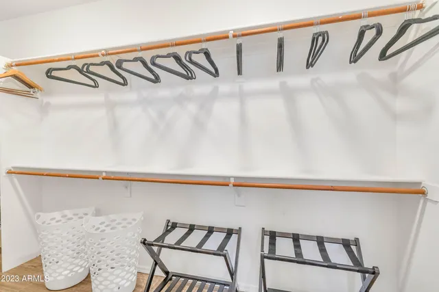 a bedroom with a bed and a dresser in it