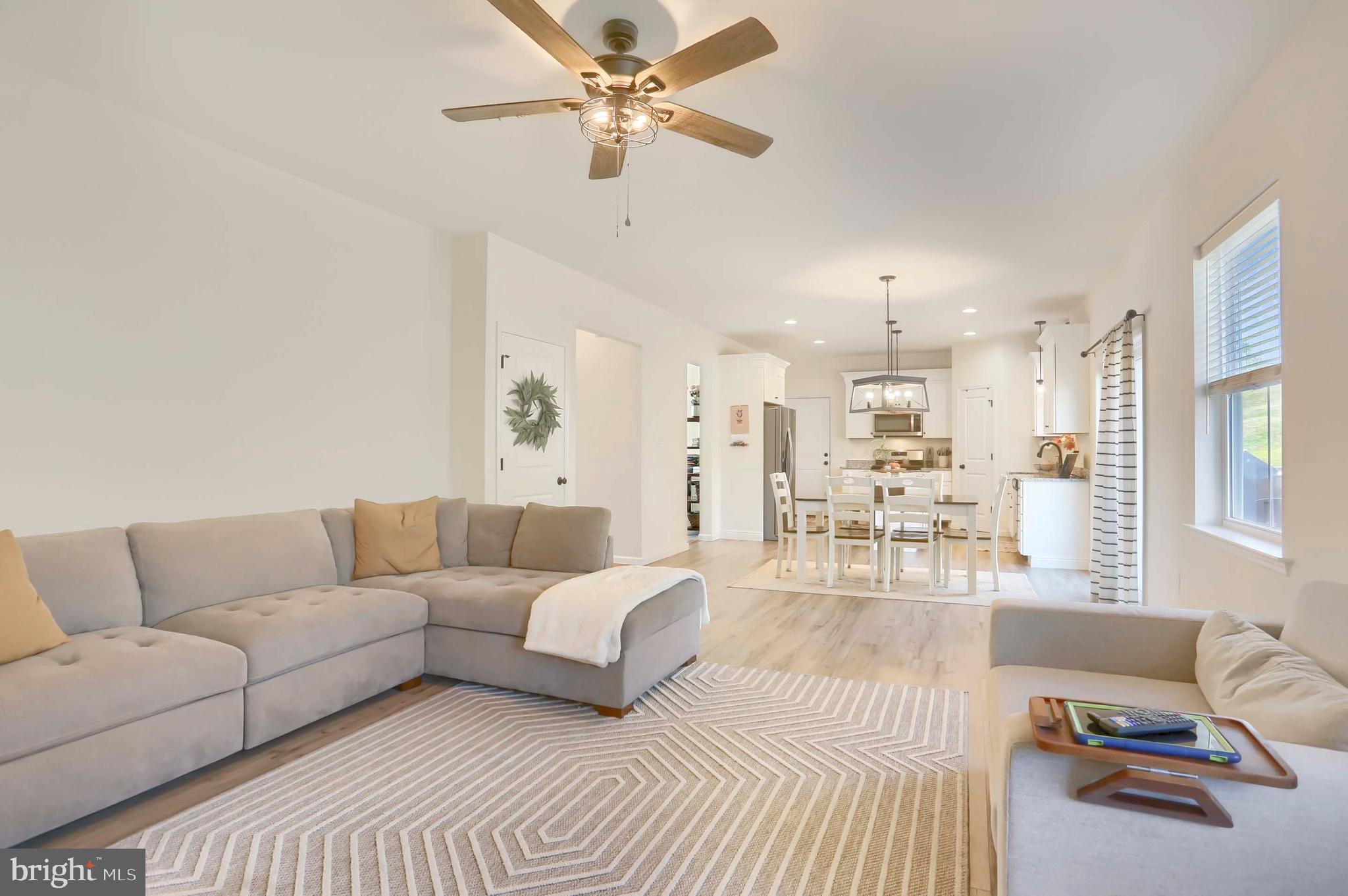 509 Elm Street Harrisburg, PA 17112 - Photo 16 of 41 a living room with furniture and a chandelier