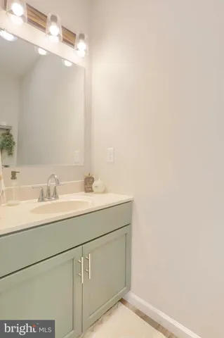 a bathroom with a shower sink and mirror