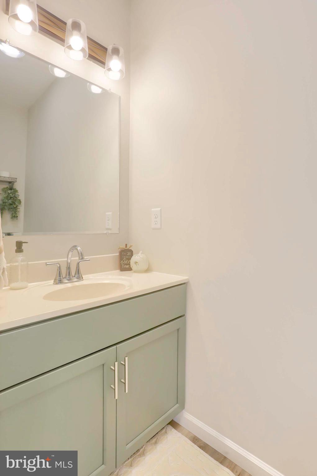 509 Elm Street Harrisburg, PA 17112 - Photo 20 of 41 a bathroom with a sink and a mirror