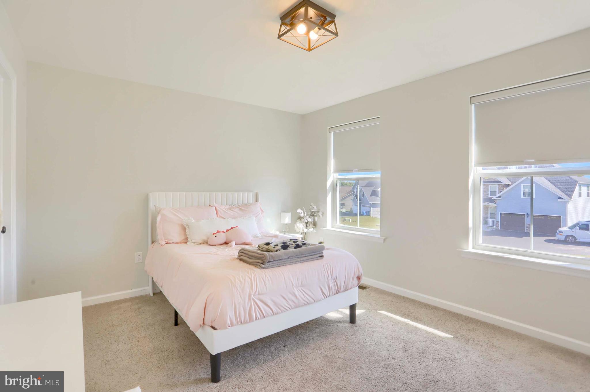 509 Elm Street Harrisburg, PA 17112 - Photo 27 of 41 a bedroom with bed and a window