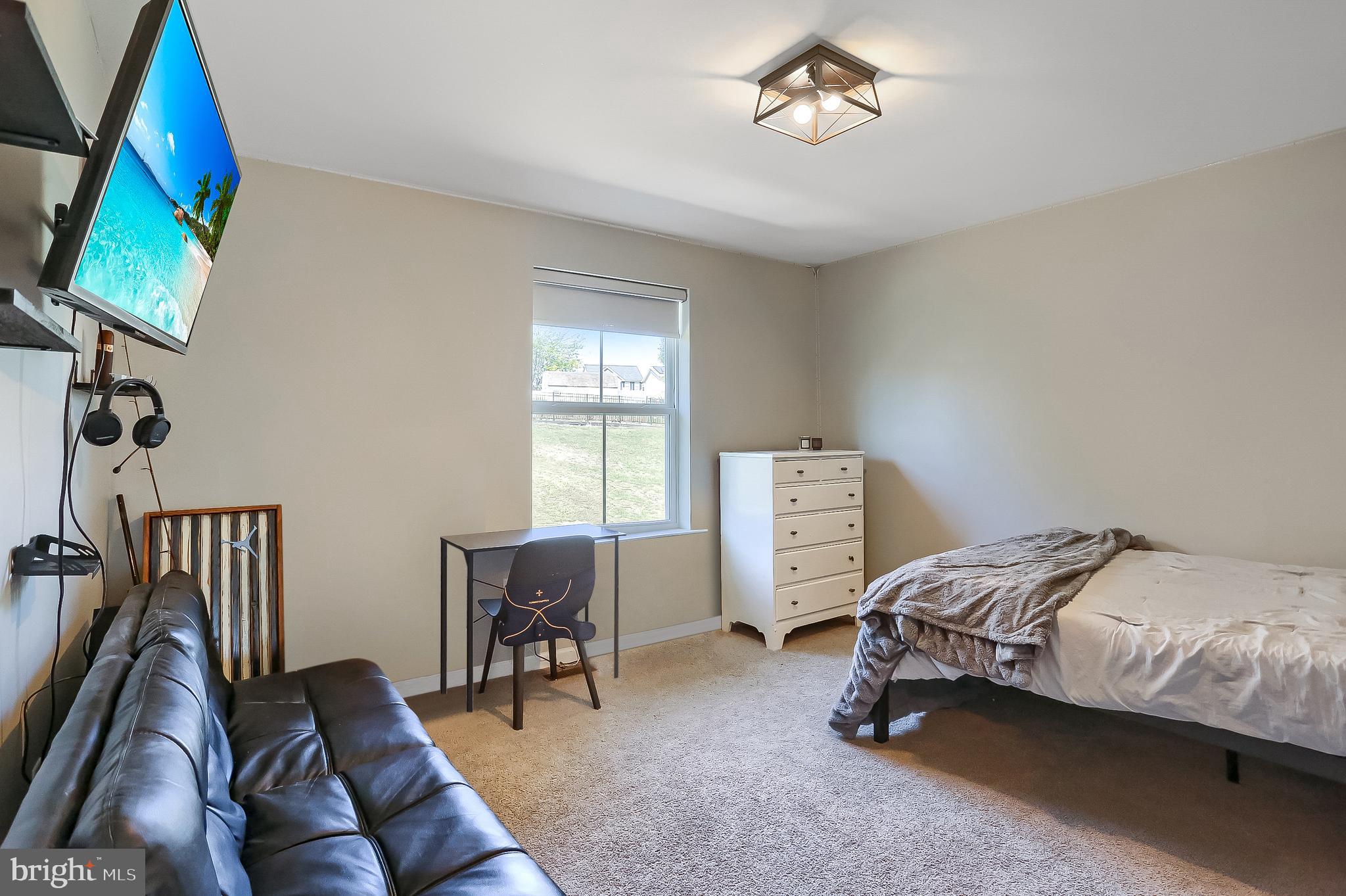 509 Elm Street Harrisburg, PA 17112 - Photo 32 of 41 a bedroom with bed and a window