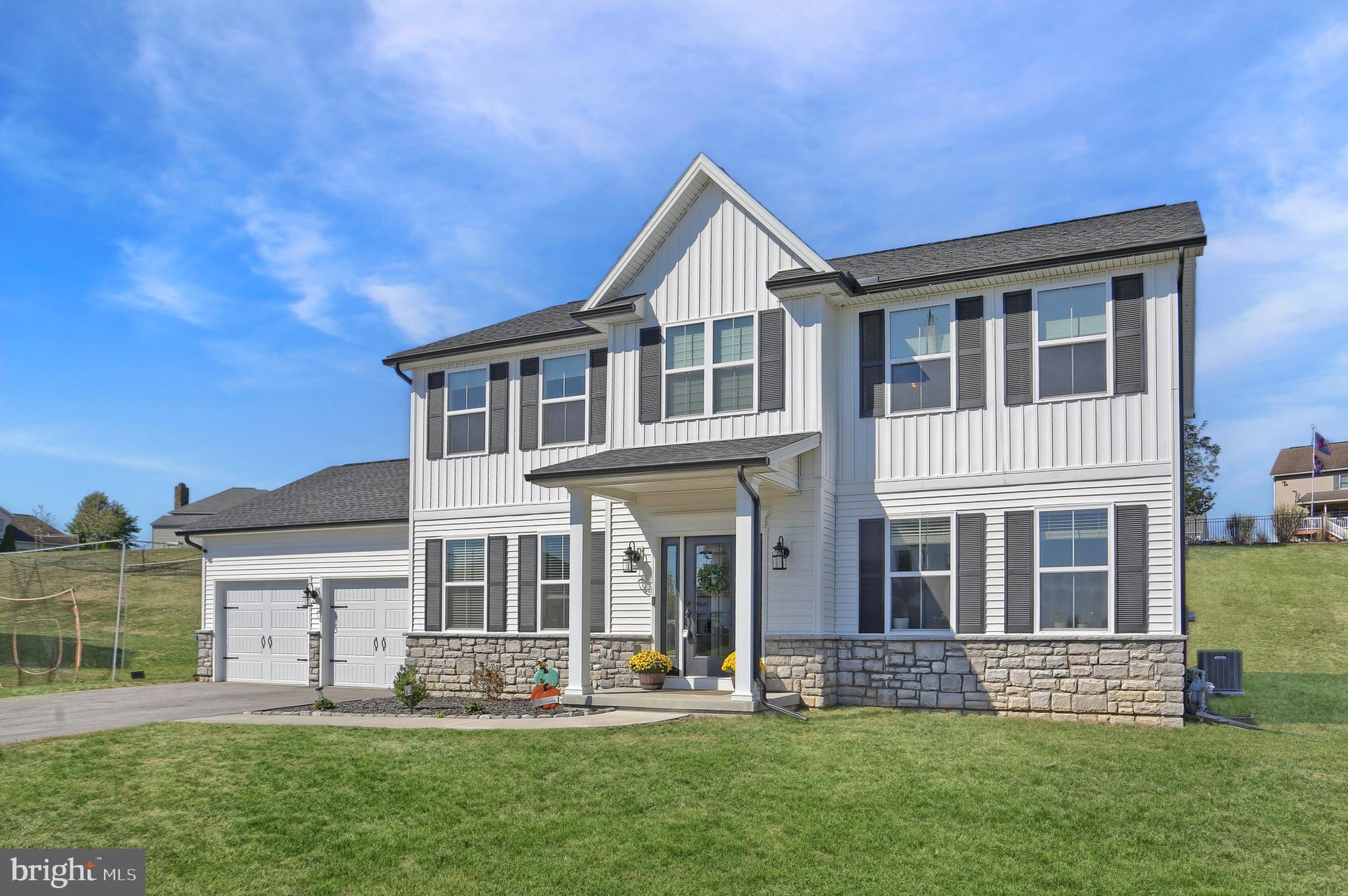 509 Elm Street Harrisburg, PA 17112 - Photo 4 of 41 a front view of a house with a yard and porch
