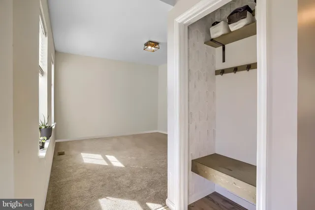 a living room with furniture and white walls