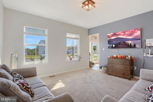 a kitchen with white cabinets and sink
