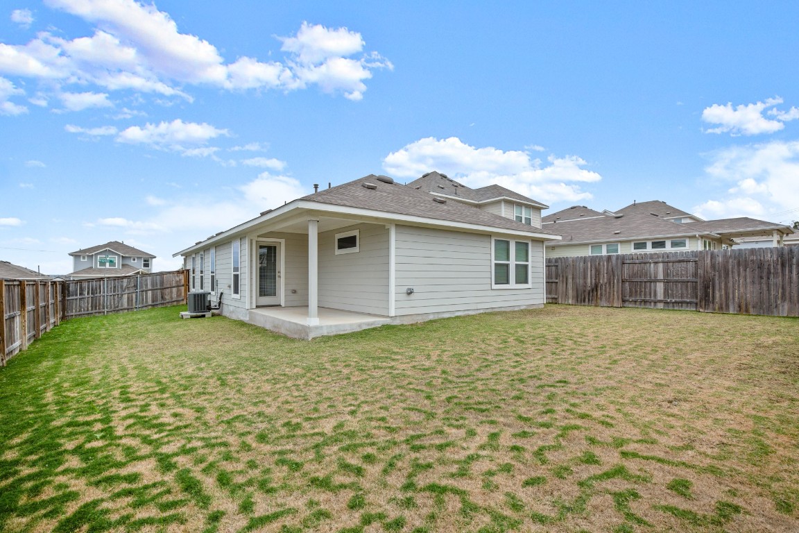 5601 Respinto Drive Austin, TX 78747 - Photo 16 of 17 a front view of a house with a garden