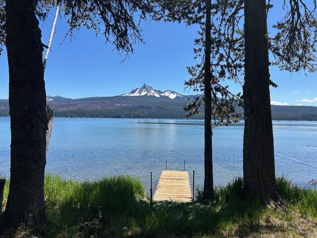 80 Diamond Lake Loop Chemult, OR 97731 - Photo 23 of 36 a view of a lake with a mountain in the background